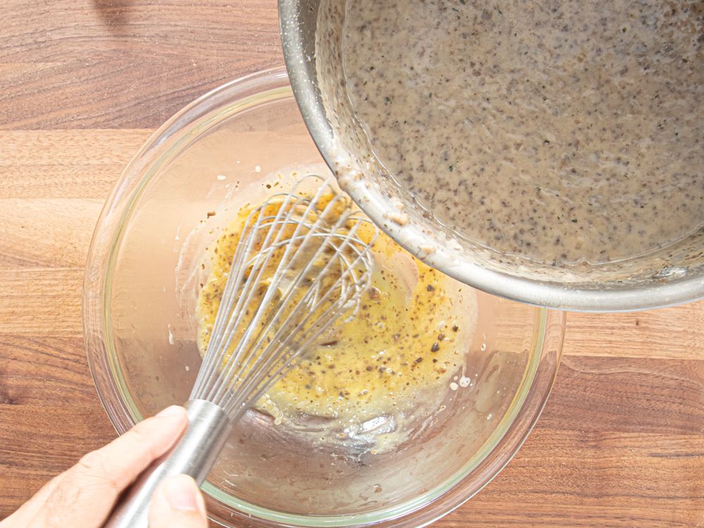 Overhead view of mixing into egg yolks