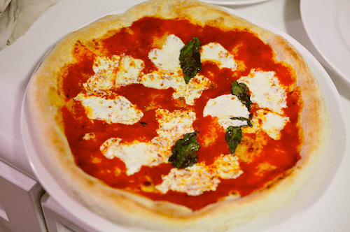 The top of a homemade Neopolitan-style pizza, looking pale. 