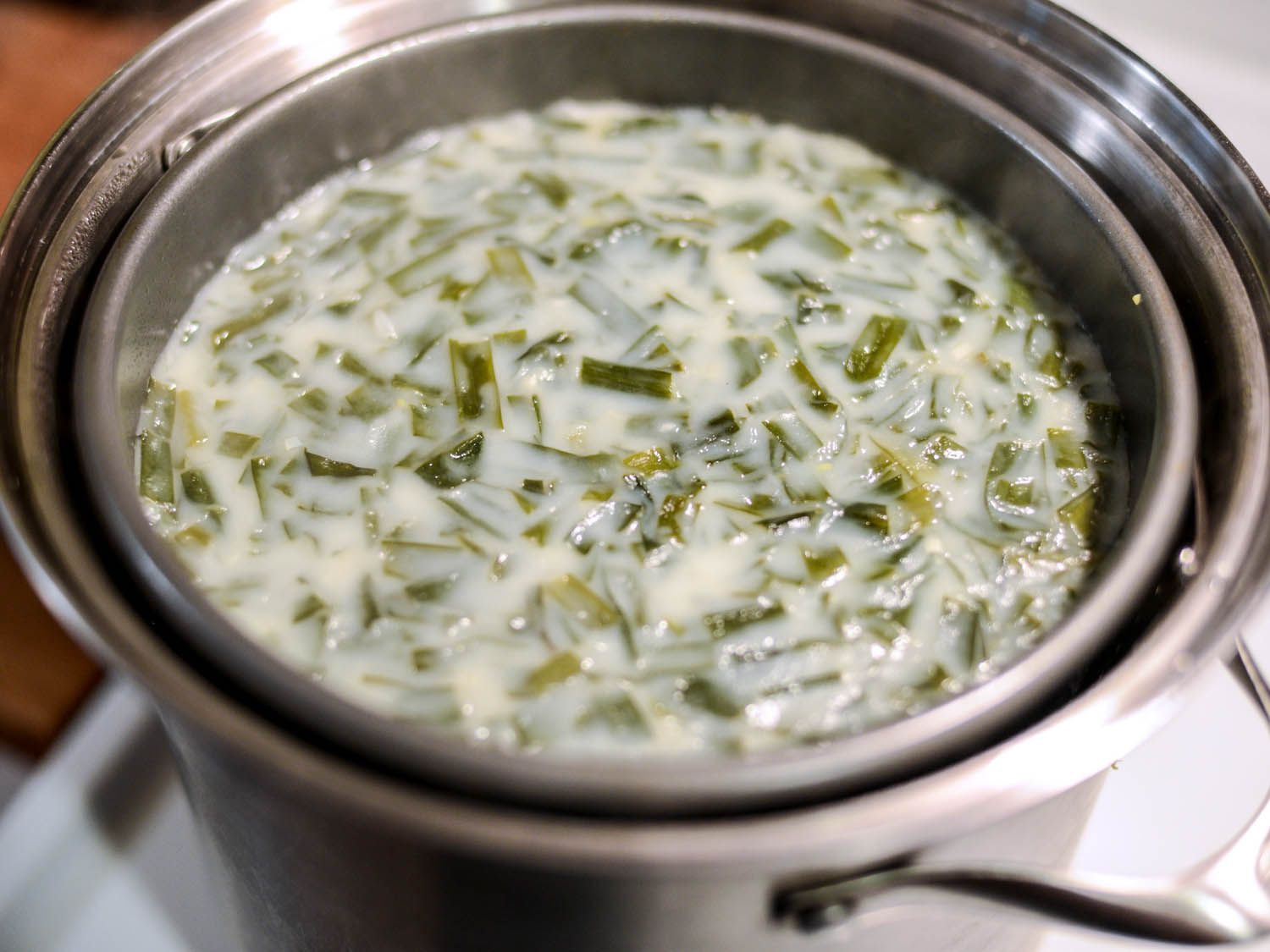 Rice cake batter steaming in a pot.