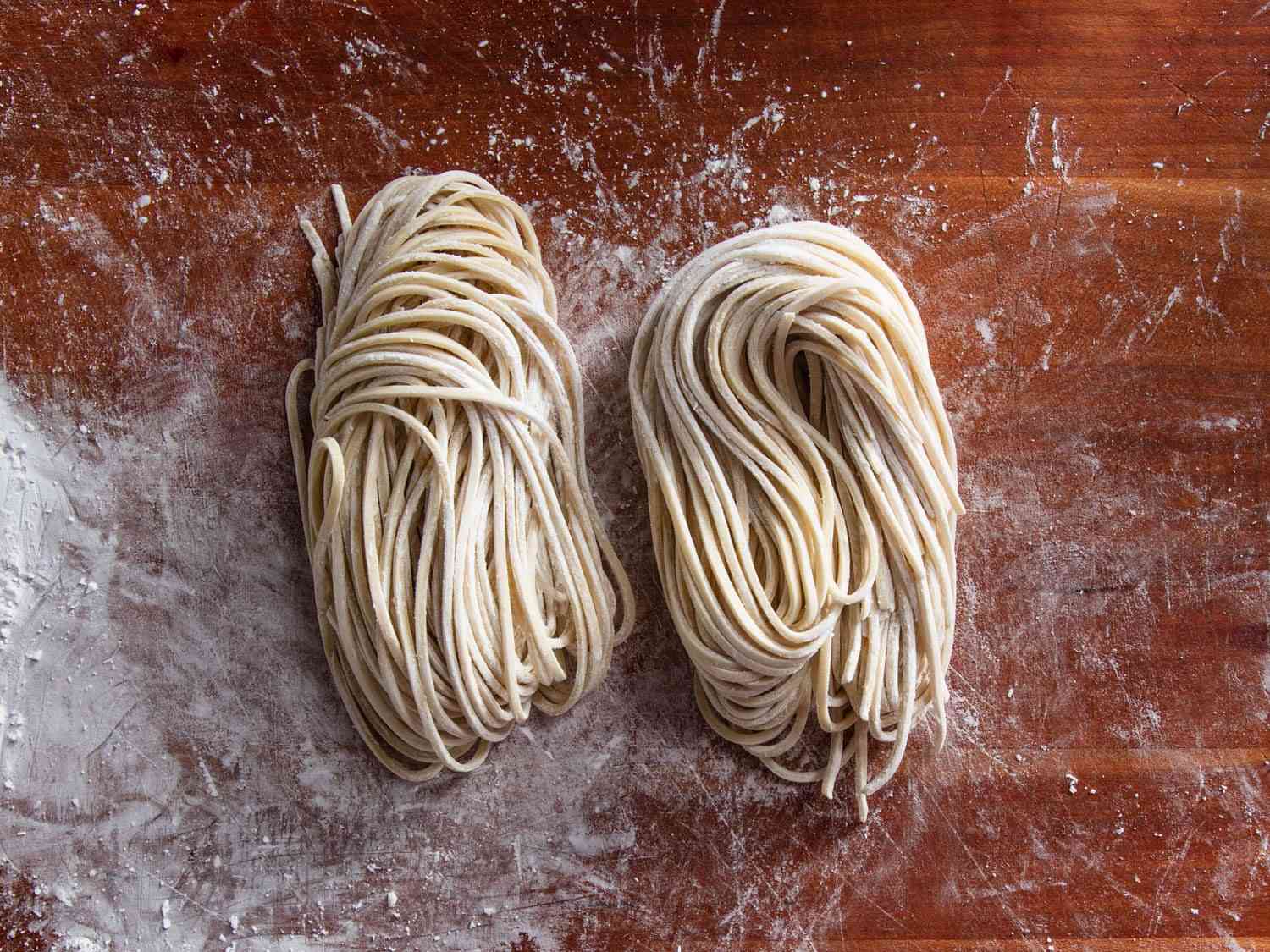 Two bundles of freshly made ramen noodles
