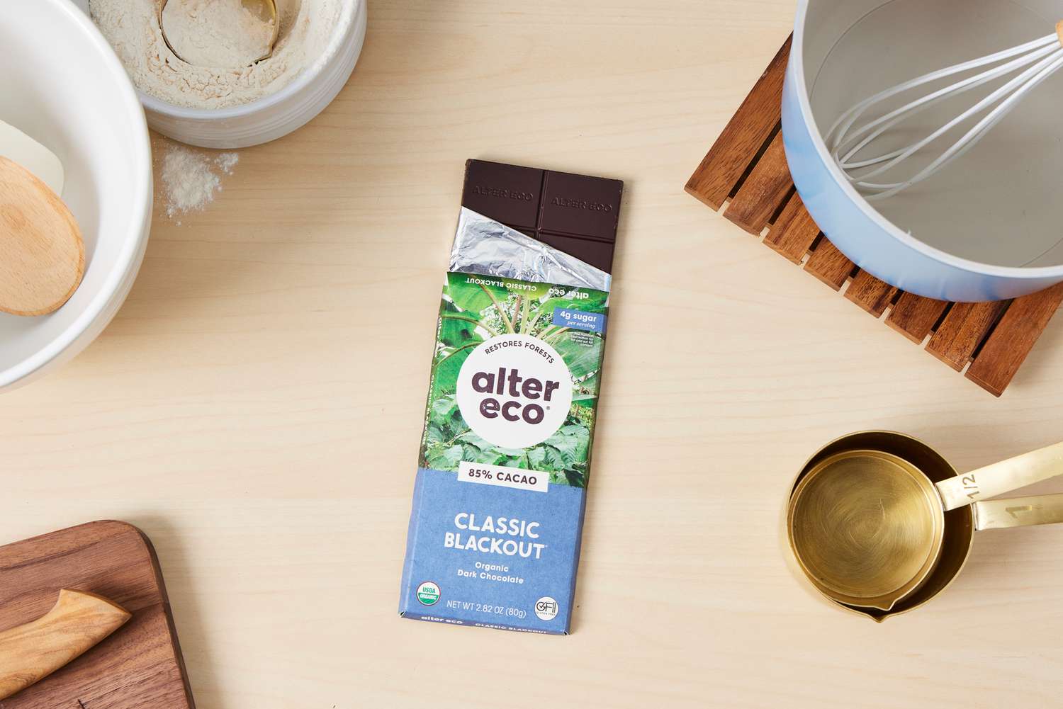 A partially unwrapped Alter Eco dark chocolate bar.