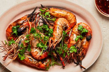 Grilled prawns with herbs and a side of sauce