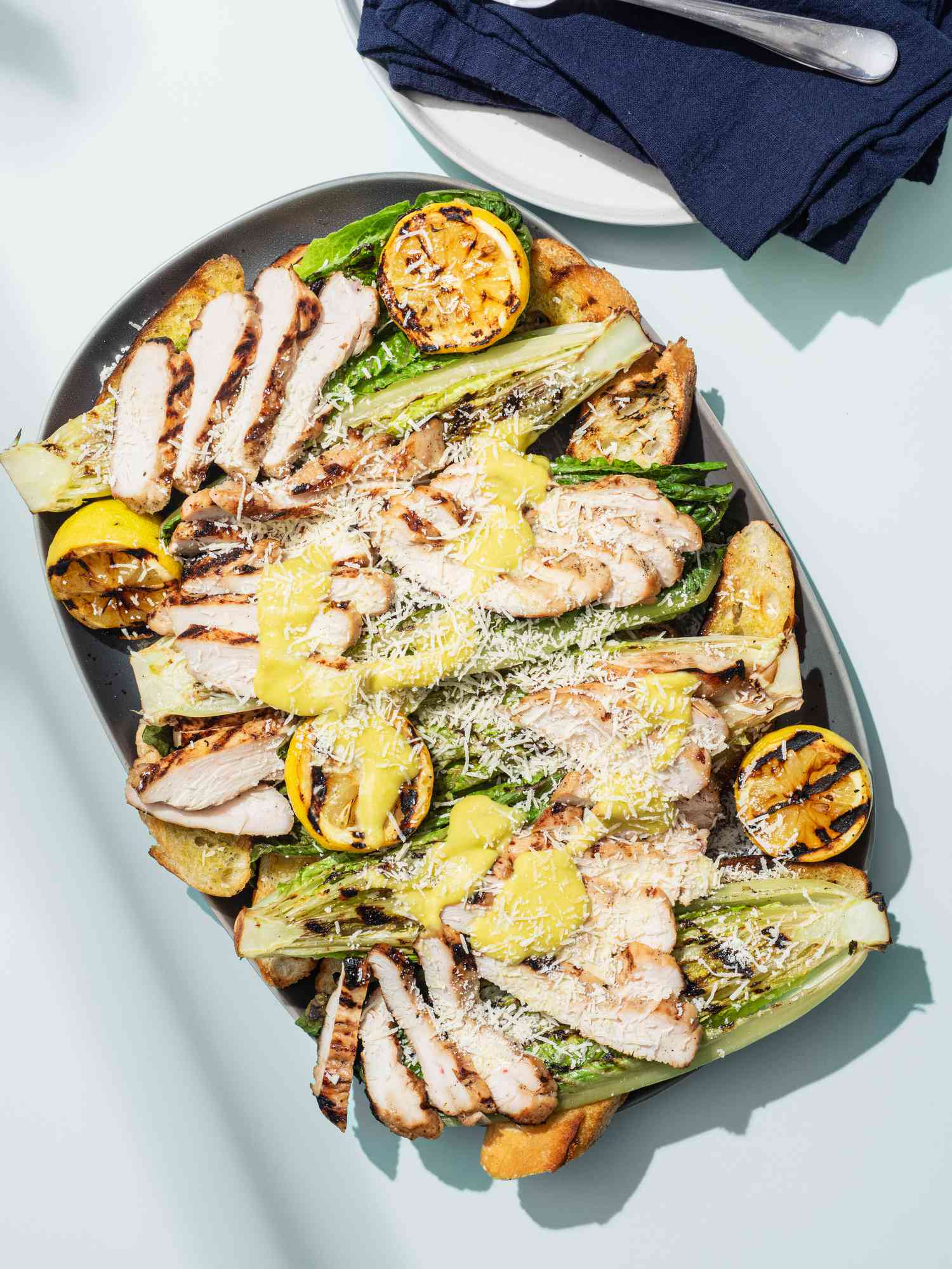 Grilled chicken caesar on a plate.