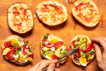 Overhead view of assembling pan bagnat sandwiches