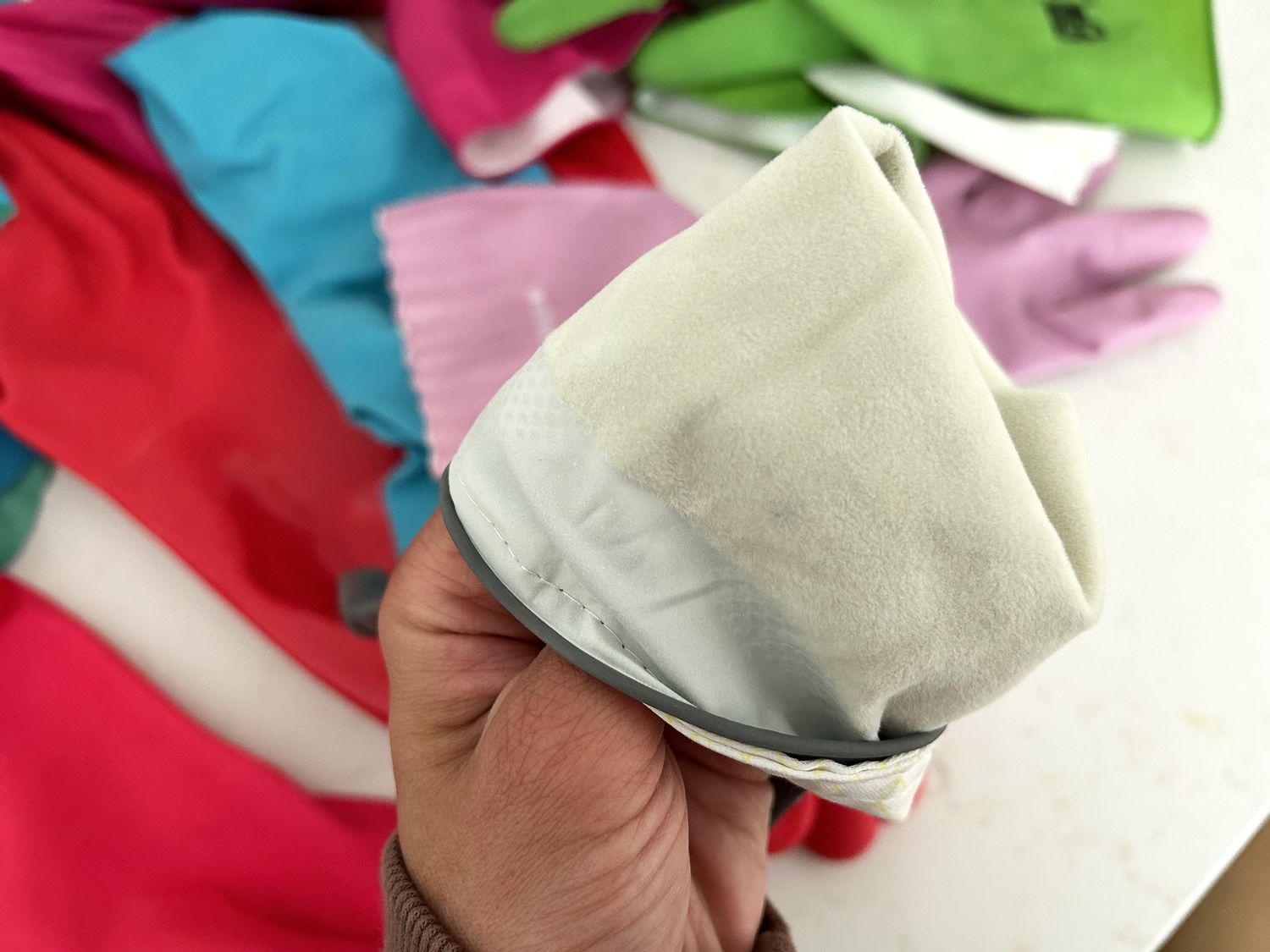 A pair of cotton-lined dishwashing gloves, turned inside-out.