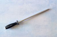 the zwilling honing rod on a blue background