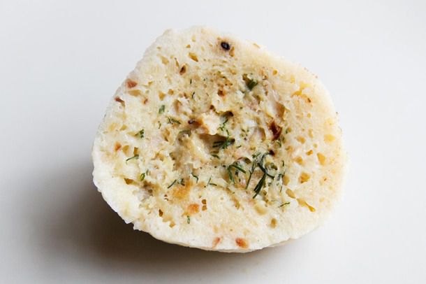 Half of a cooked chicken-stuffed matzo ball, with filling visible