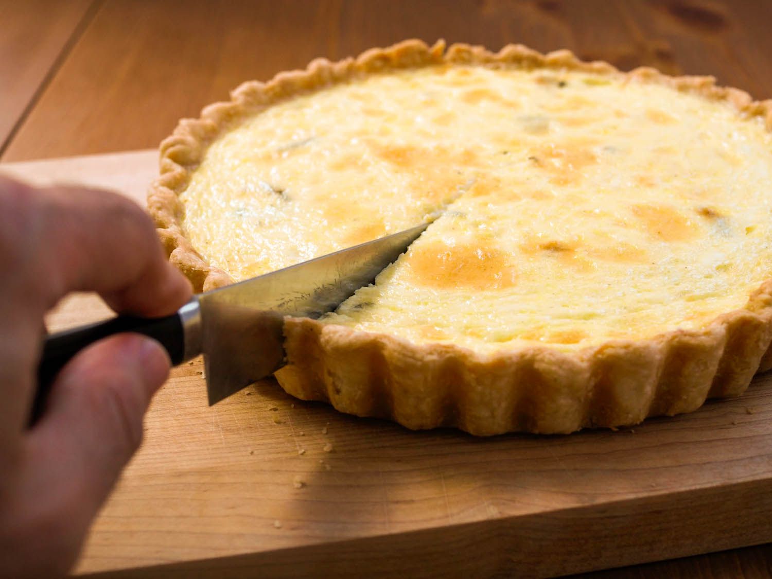 Author cutting into the cheese quiche.