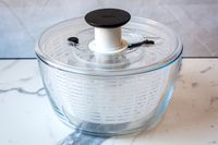 the oxo glass sald spinner on a marble surface