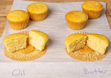 Four muffins labeled Oil and Butter one muffin from each group sliced in half to show texture