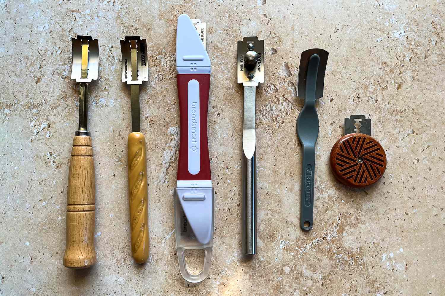 A collection of bread lames on a kitchen counter