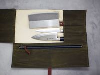 The hardmill knife roll opened to show three knives inside