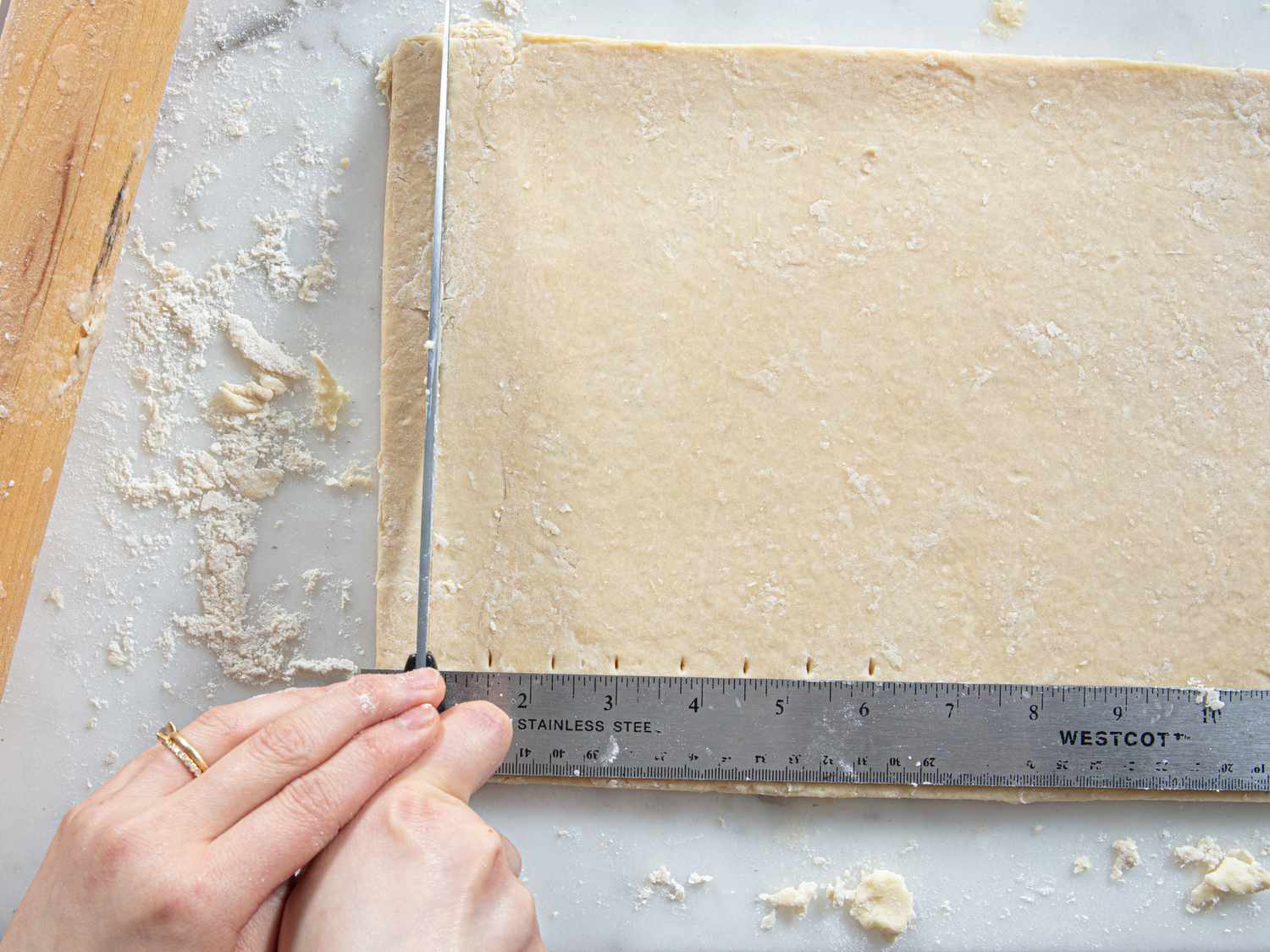 Overhead view of trimming dough