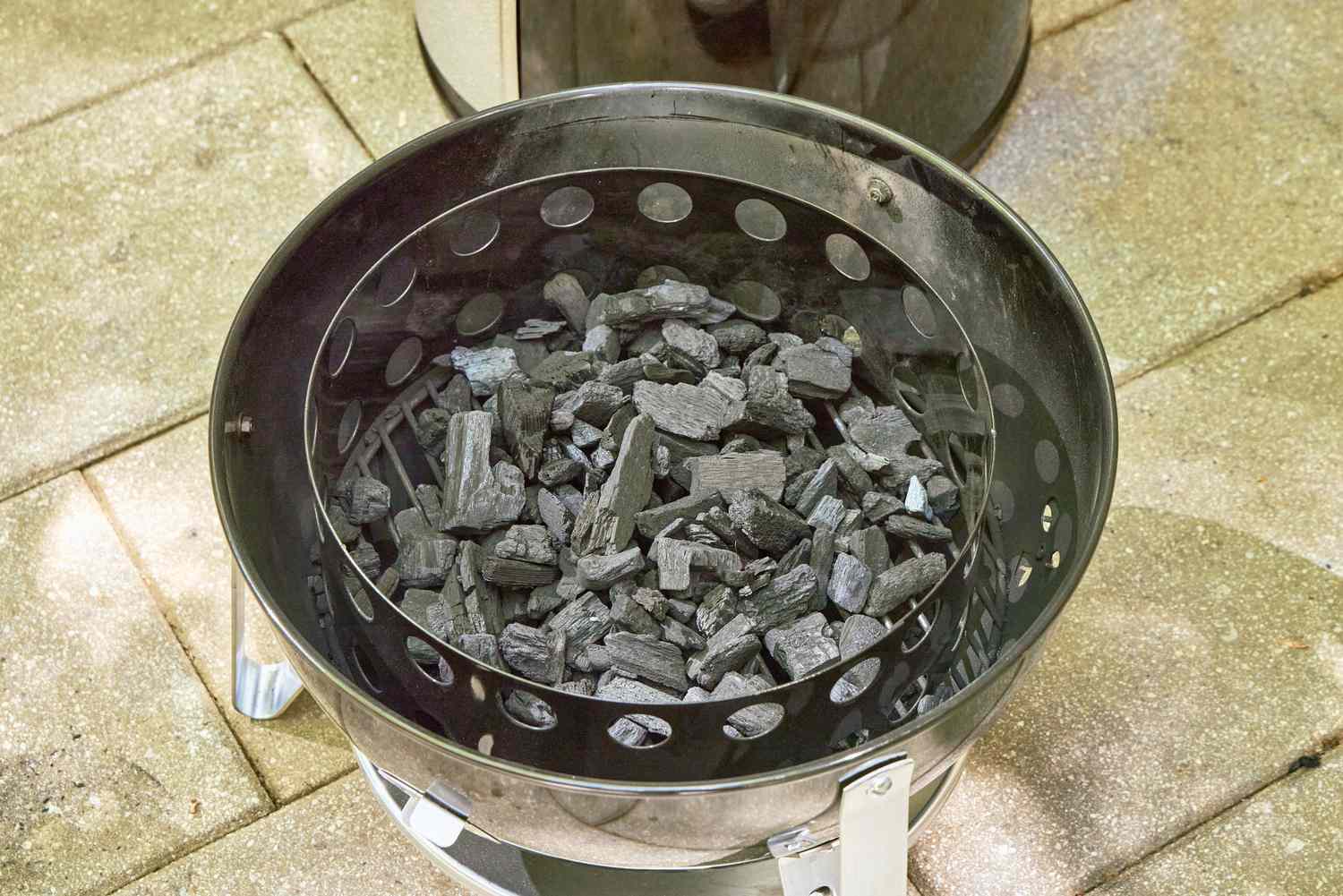Charcoal inside the Weber 18-Inch Smokey Mountain Cooker