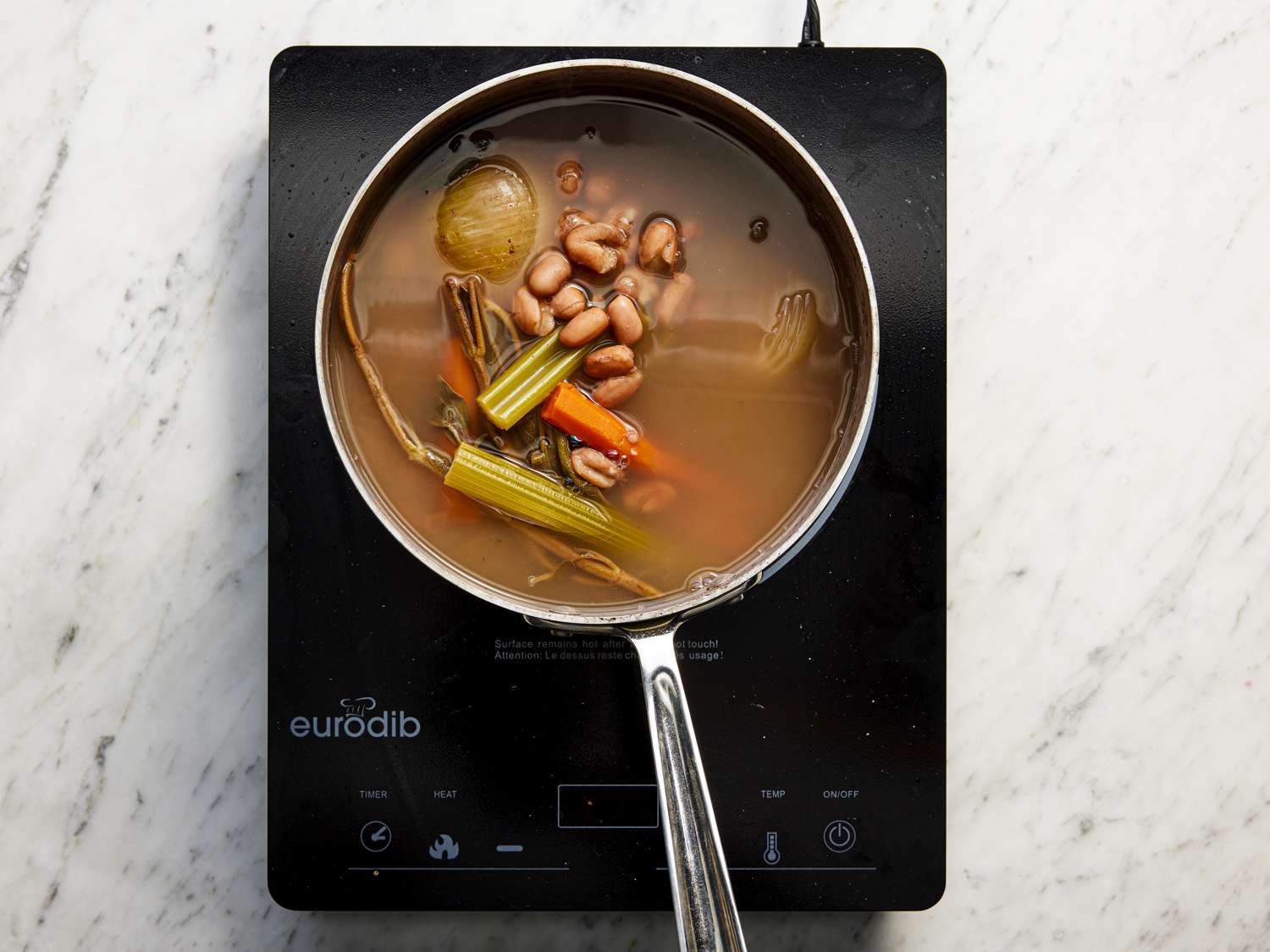Beans and ingredients in a pot