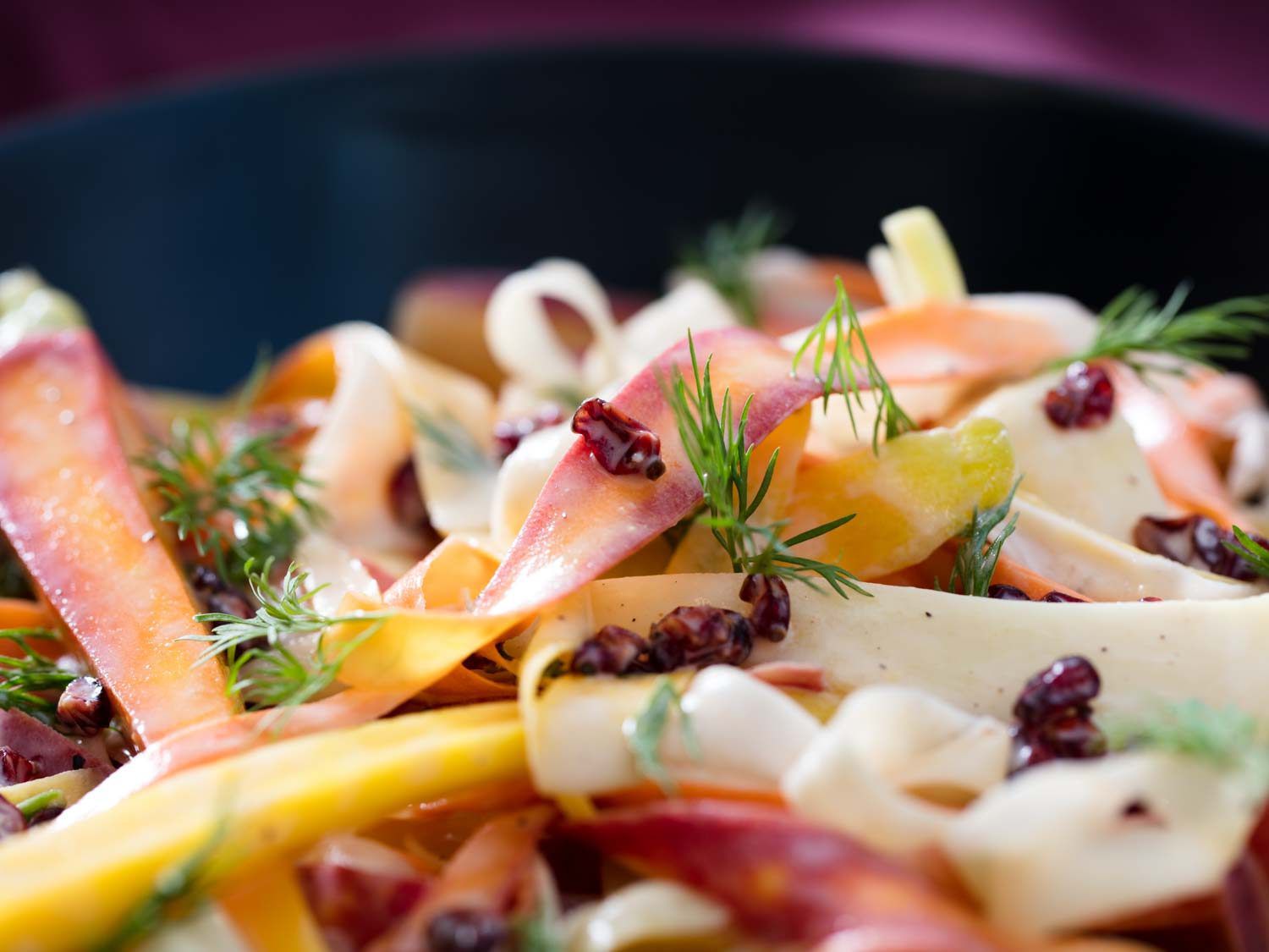 close up of carrot salad with ghee, yogurt, and barberry dressing