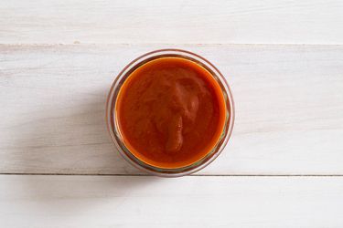A small bowl of buffalo barbecue sauce. 