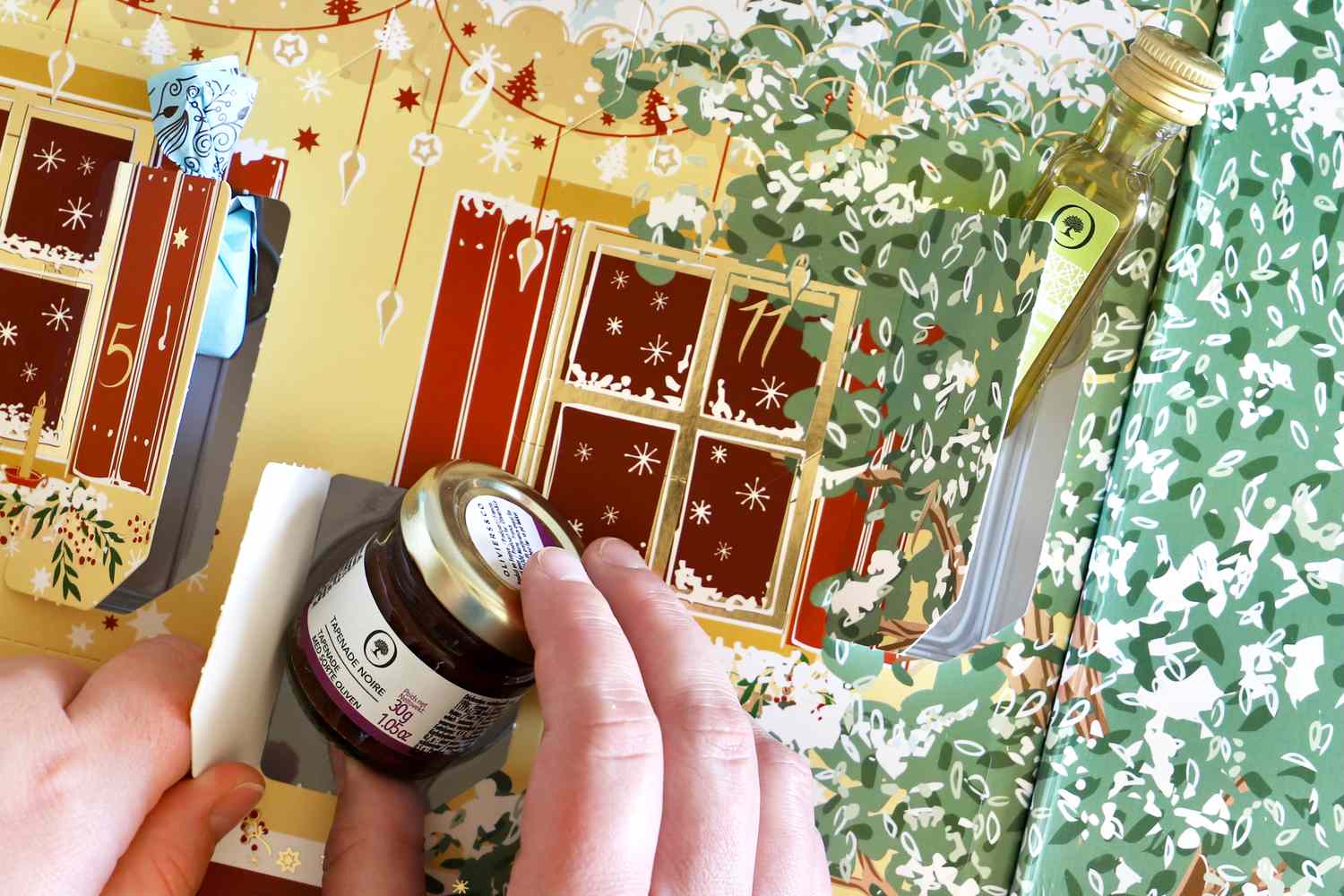 Contents of the Oliviers & Co Advent Calendar peeking out of their doors