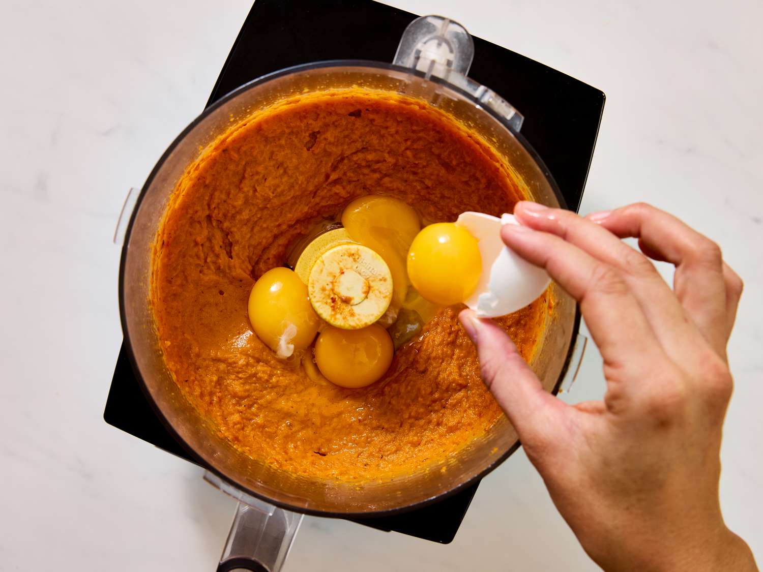 adding egg yolks to curried squash mixture 
