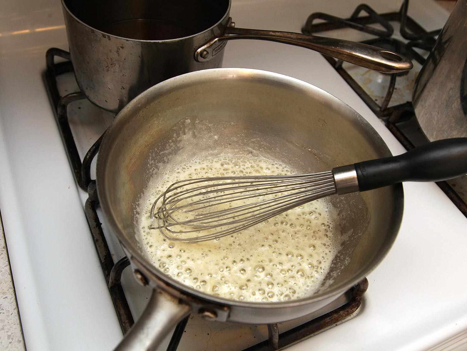 Butter sizzling in a saucepan. 