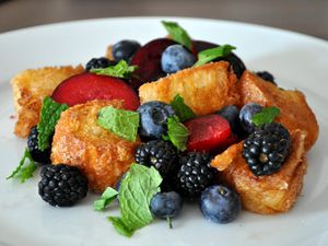 Closeup of plate full of summer fruit panzanella.