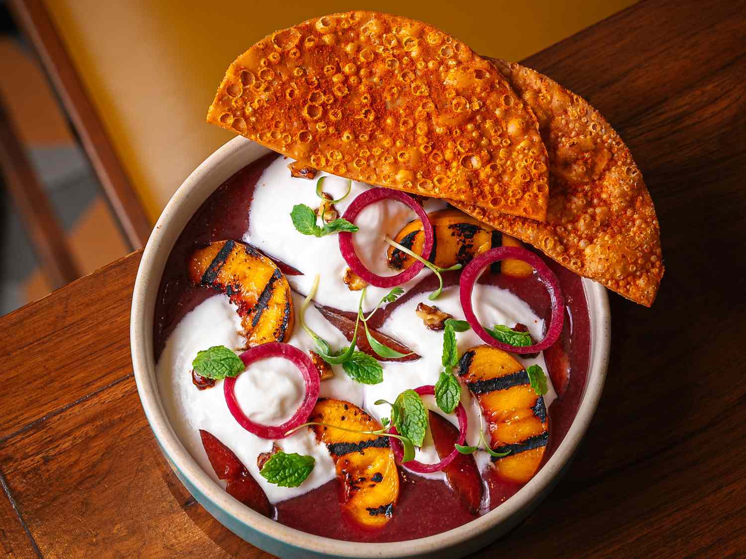 Overhead view of the stone fruit chaat at The Bombay Canteen
