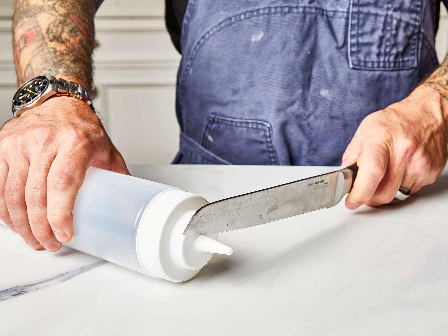 Side view of cutting lid off of squeeze bottle