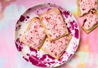 Plate of strawberry rhubarb pop-tarts on a colorful background