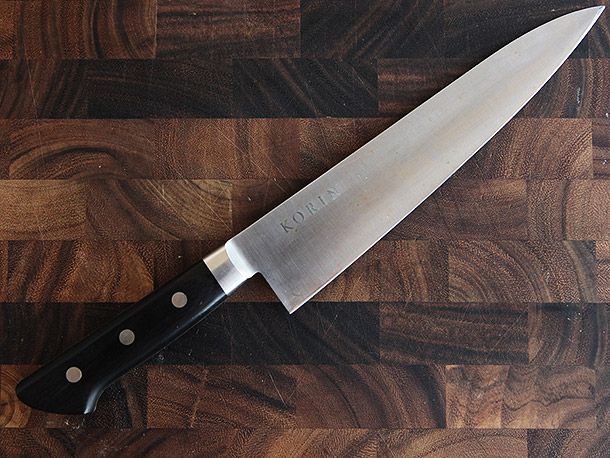 Korin knife on wood cutting board