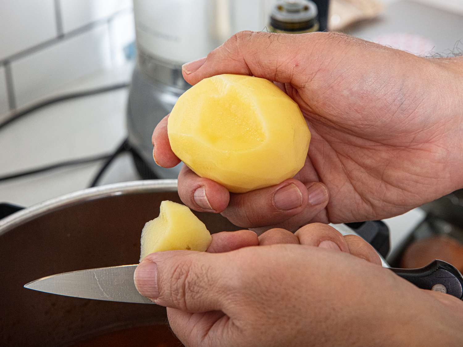 Cutting potato into stew