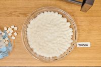 Marshmallows heated in the Toshiba EM131A5C-BS Microwave Oven in a bowl on a wooden surface