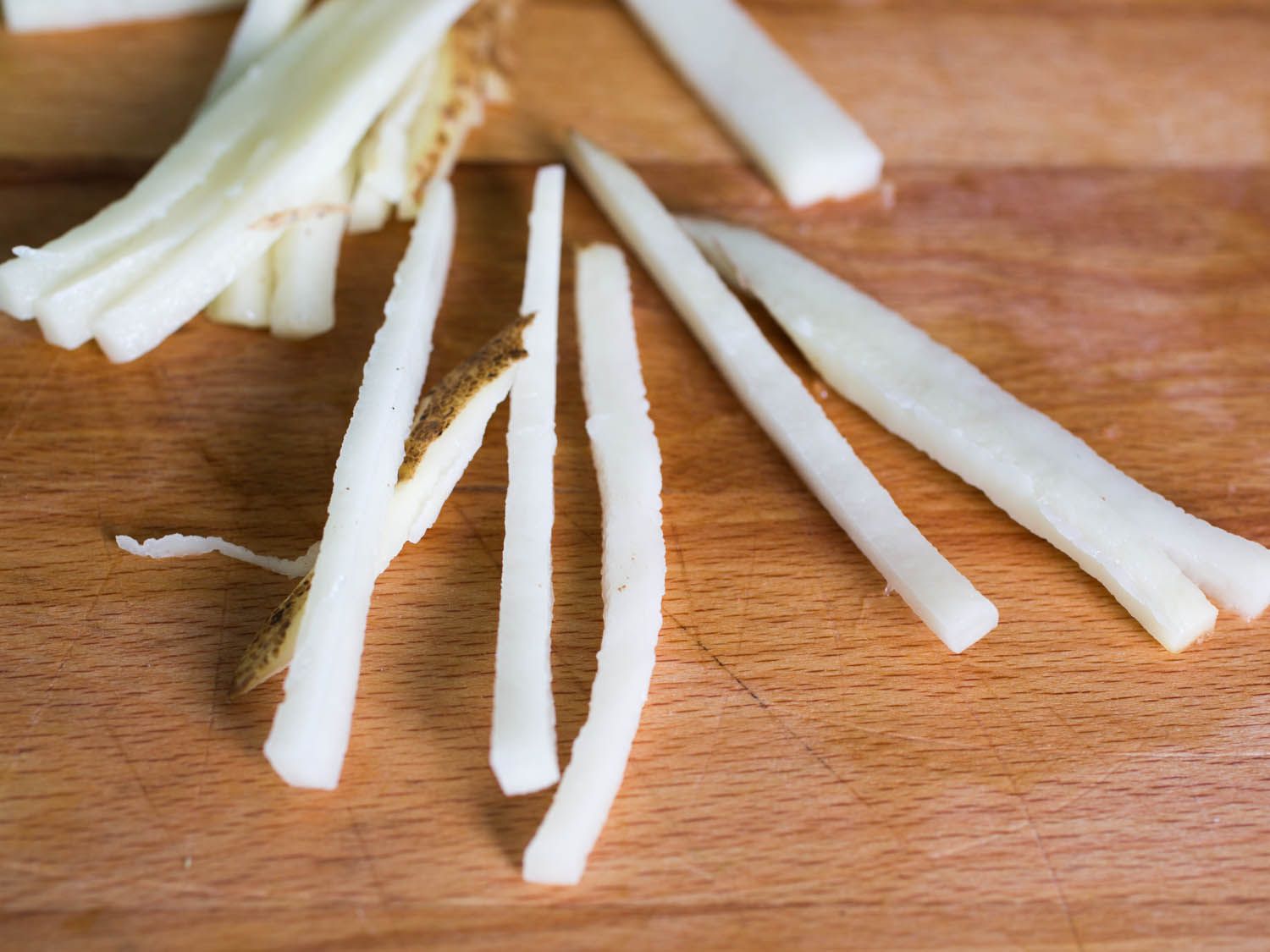 Unevenly sliced pieces of potato from the Benriner Mandoline