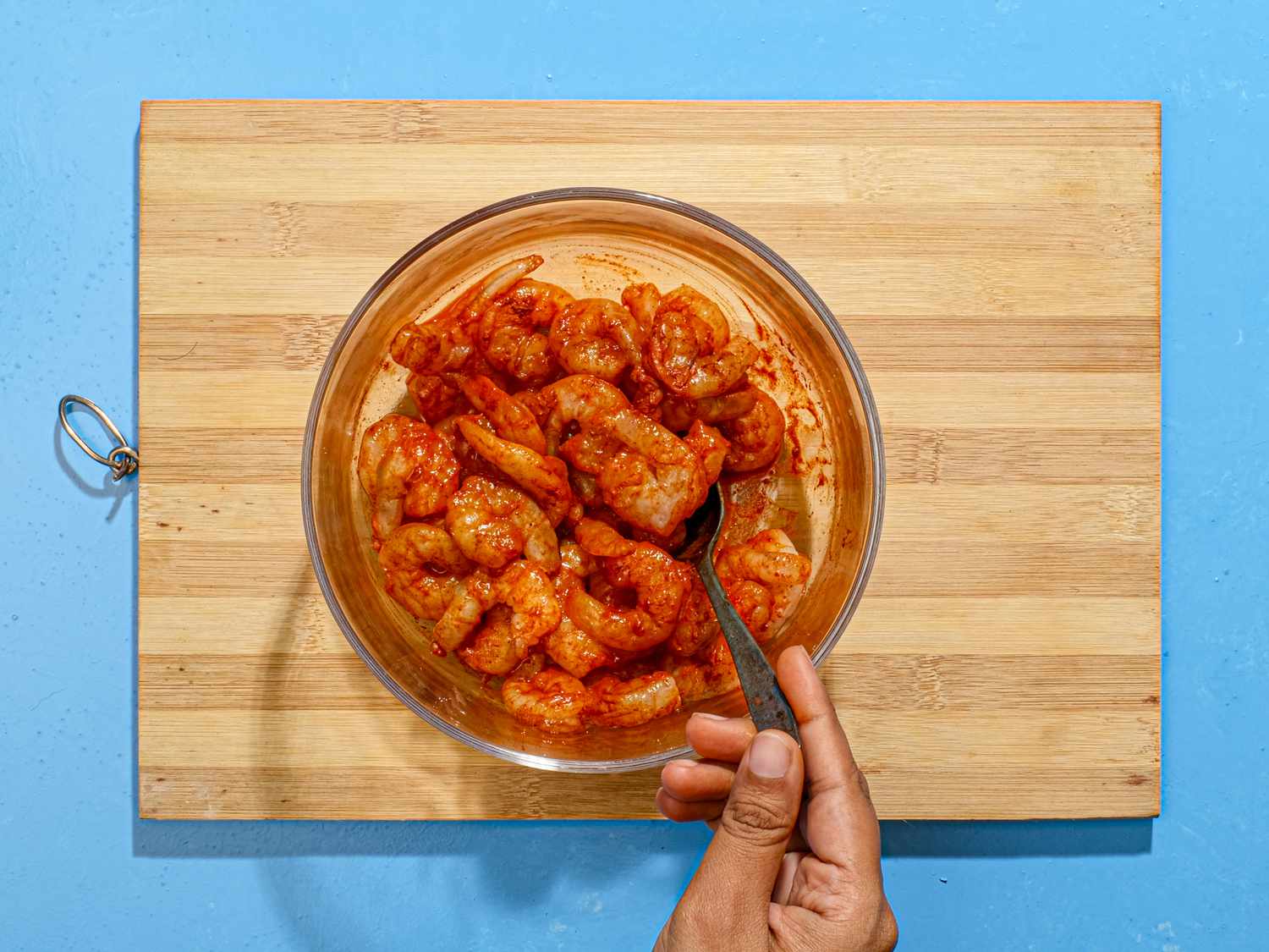 Overhead view of stirring shrimps