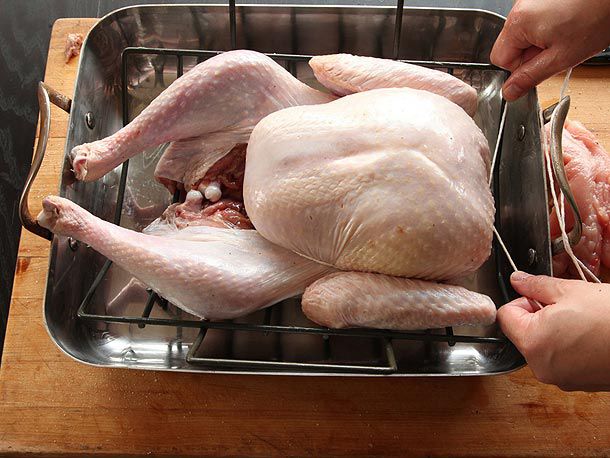 Twine wrapped around the turkey breasts and tucked under the wings