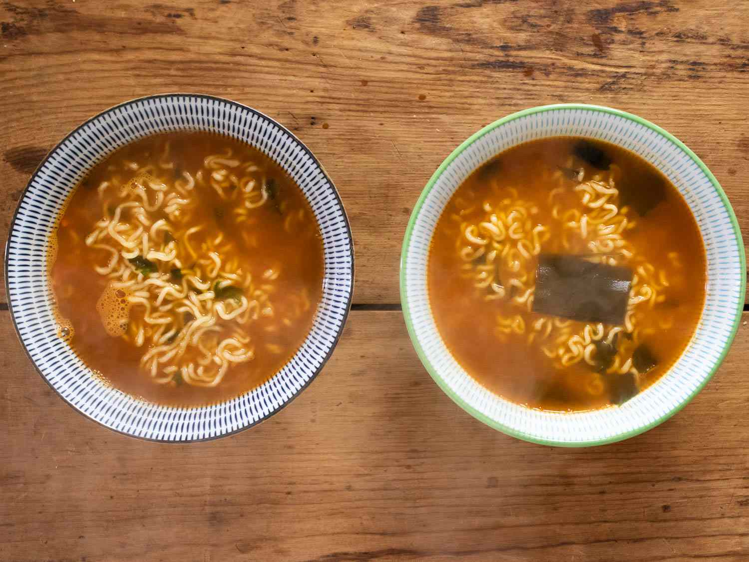 Prepared Neoguri Seafood Noodles in bowls side by side, with Korean version on the right.