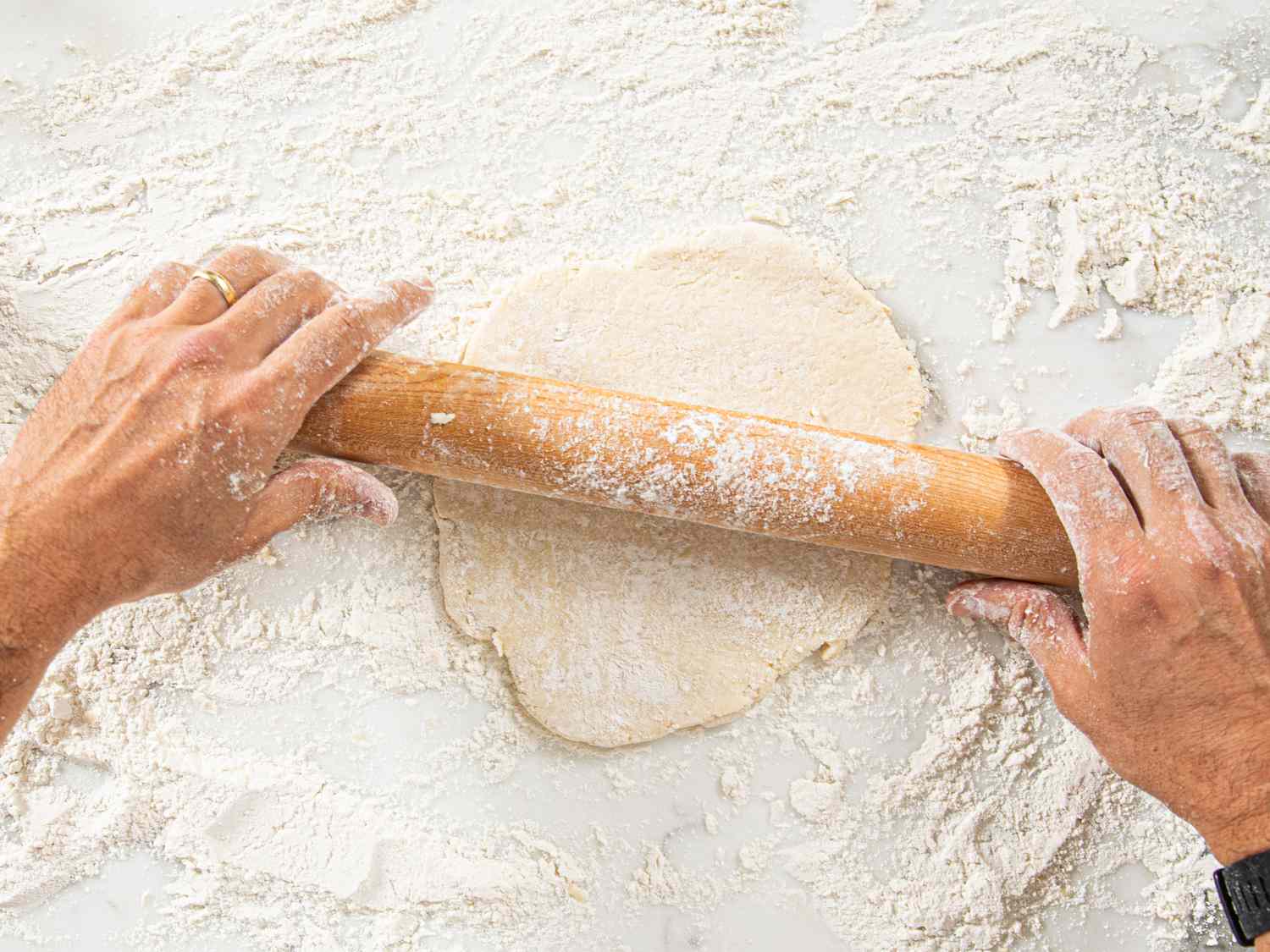 Overhead view of rolling out the dough