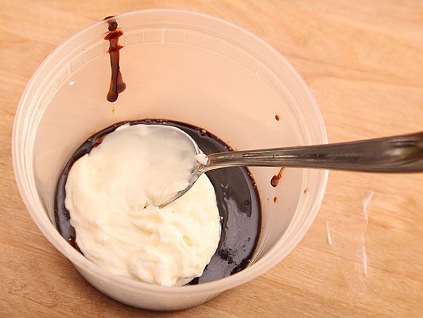 Mayonnaise in a plastic container with a thick sauce reduced from pork belly marinade