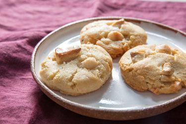 Trio of white chocolate macadamia nut cookies plated
