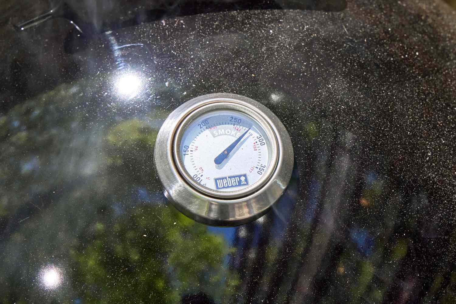 The thermometer on the Weber 18-Inch Smokey Mountain Cooker