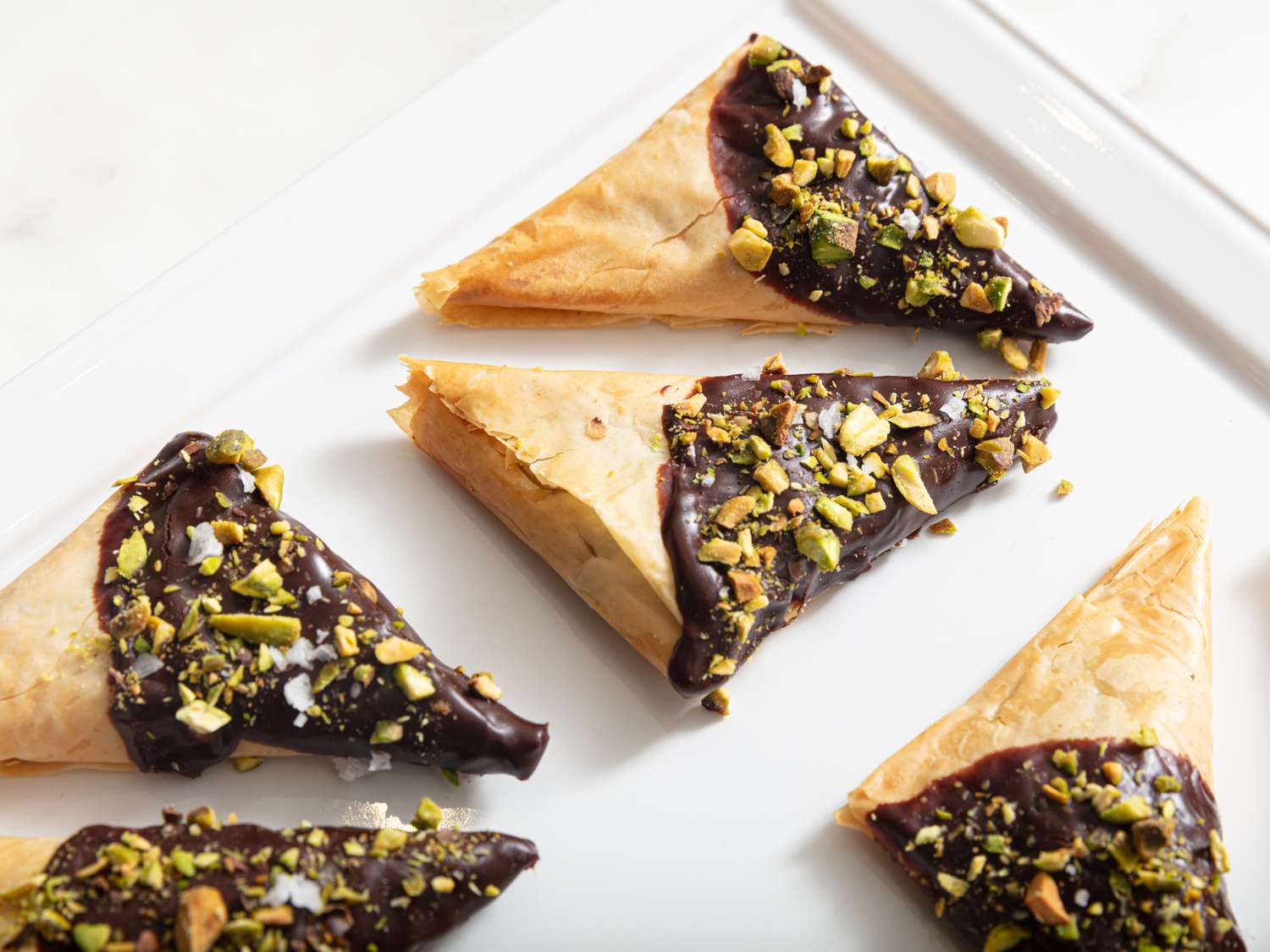 triangles arranged on a white platter 