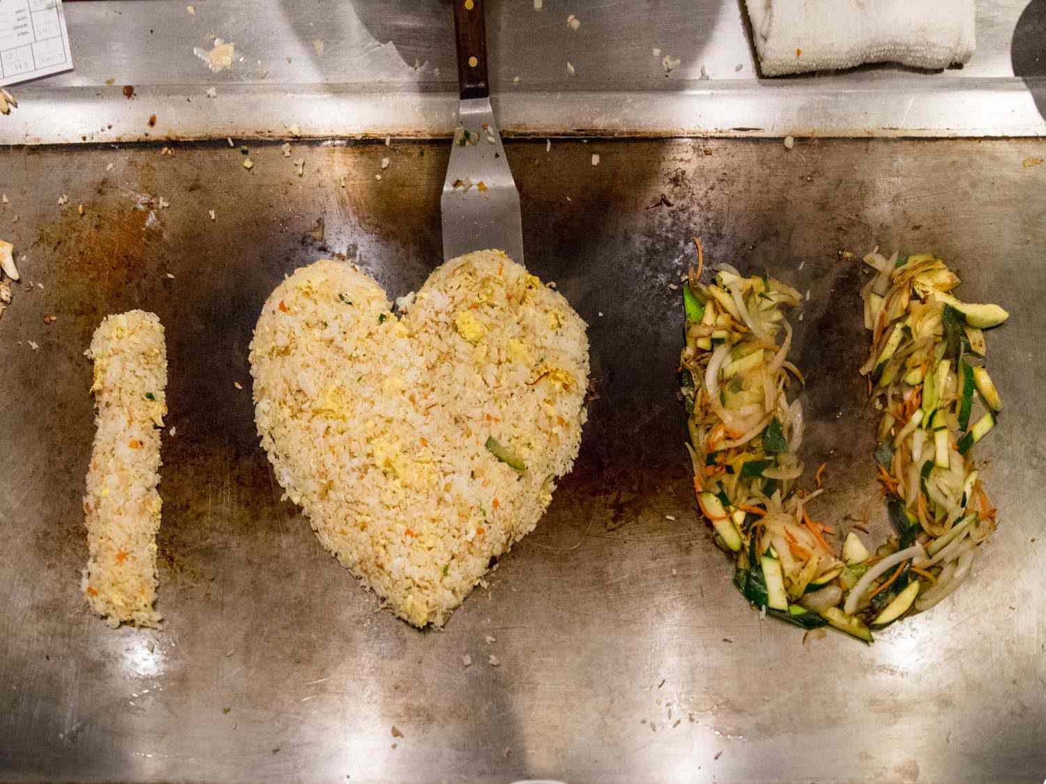 Benihana's signature fried rice, molded together to spell out I Heart You