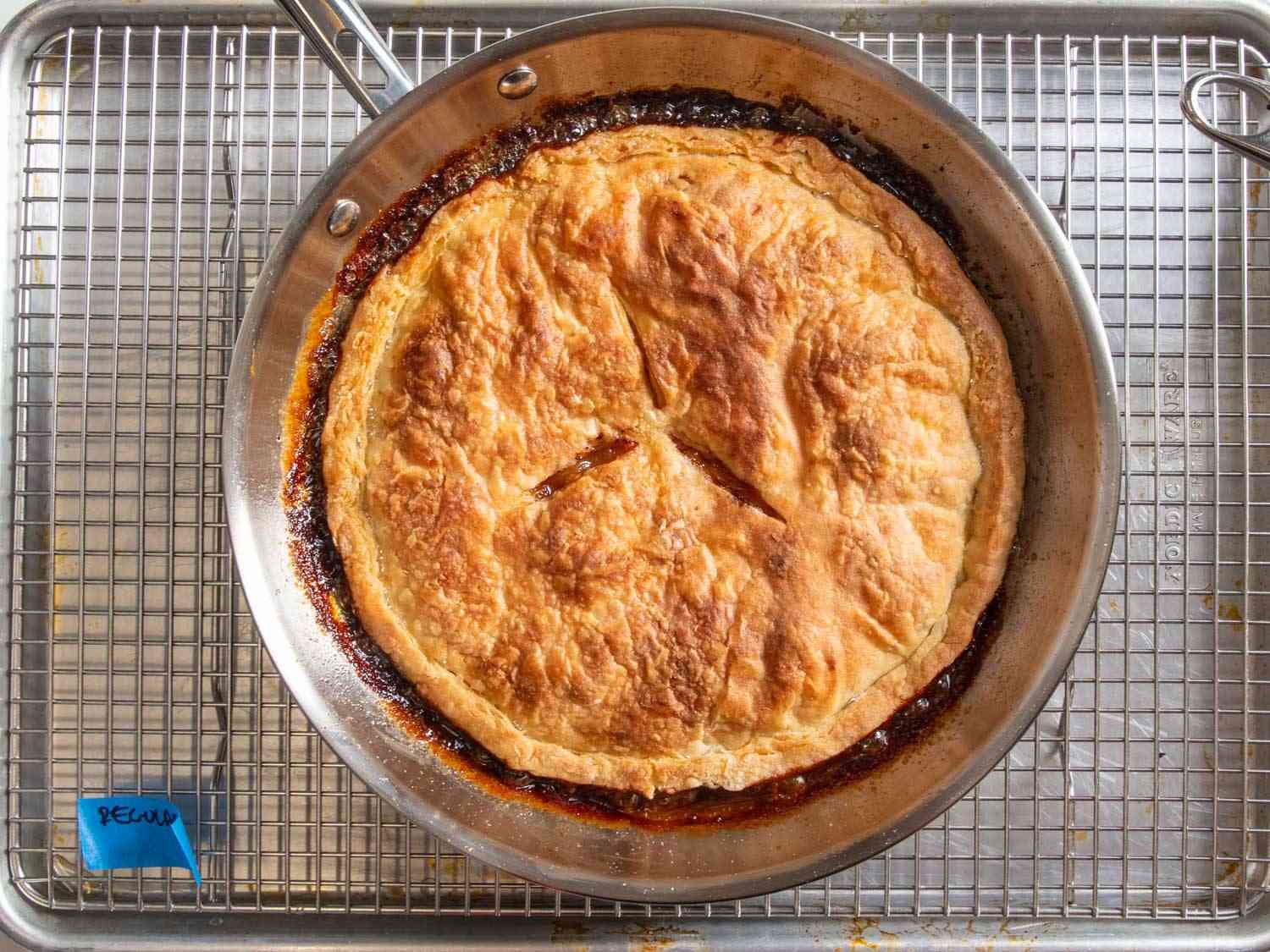 A pie dough tarte Tatin baked in a stainless steel skillet