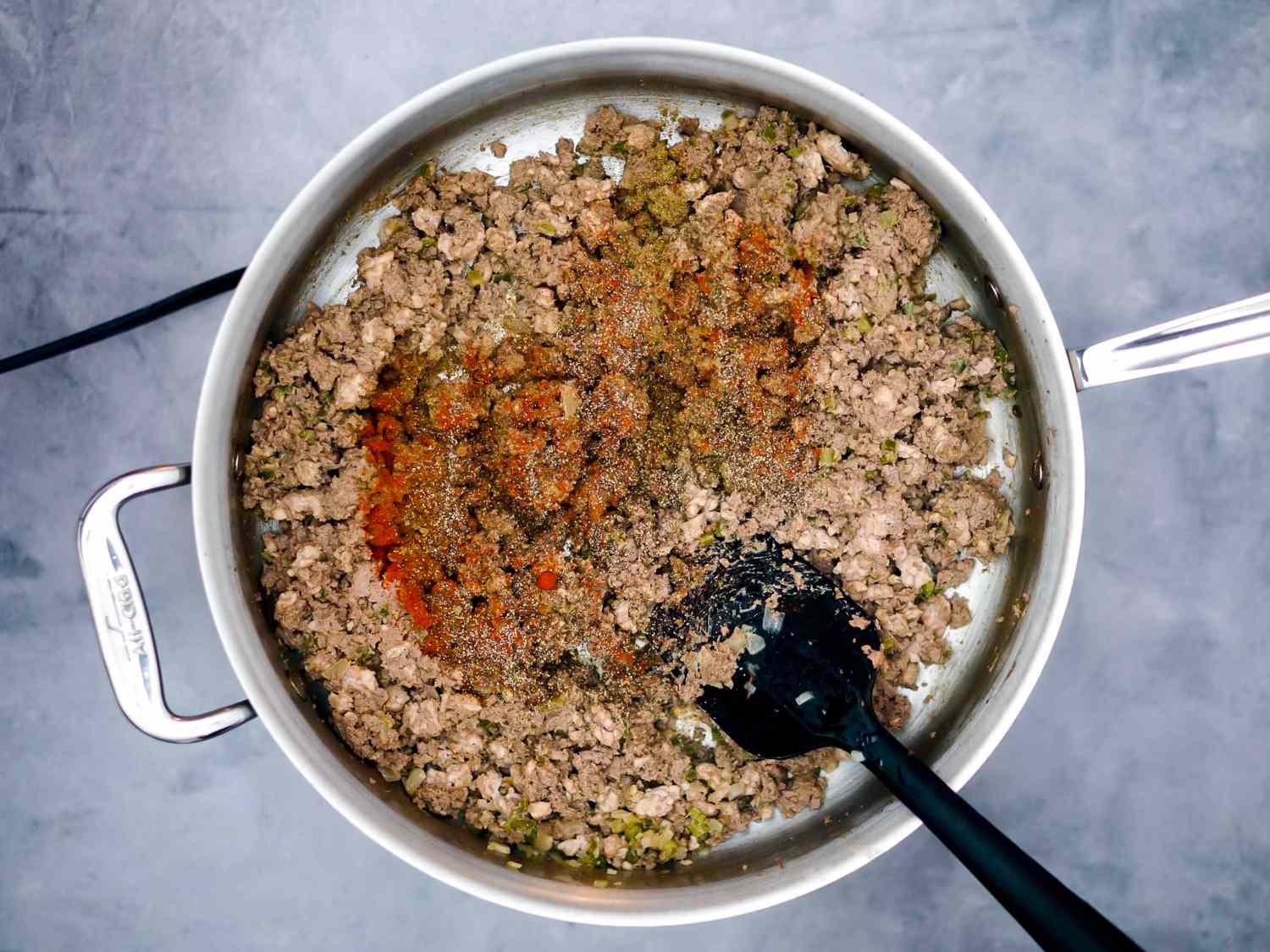 ground meat and vegetable mixture returned to skillet with seasoning