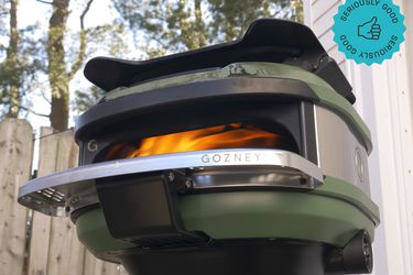 the gozney tread with a fire lit inside it