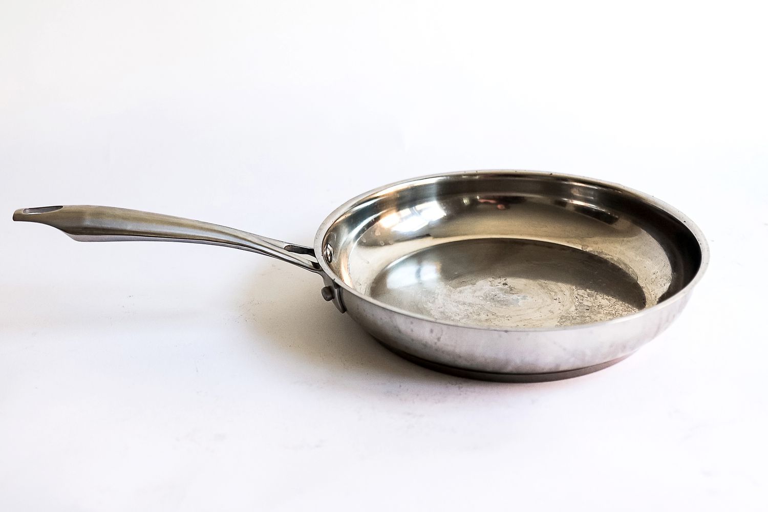 A pan from the Cuisinart Professional Series Cookware 11 Piece Set on a white surface