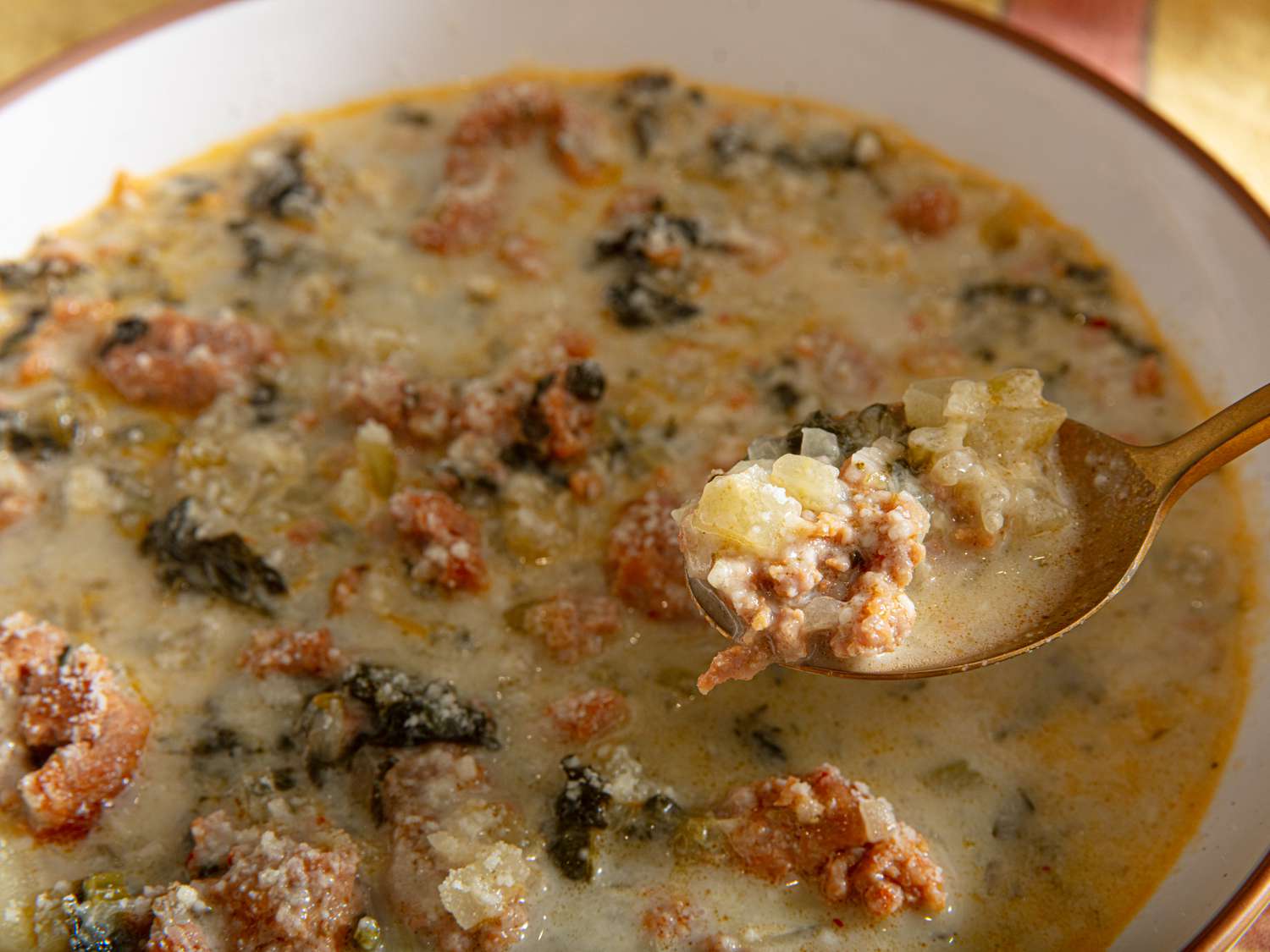 Lift of a bite of Zuppa Toscana