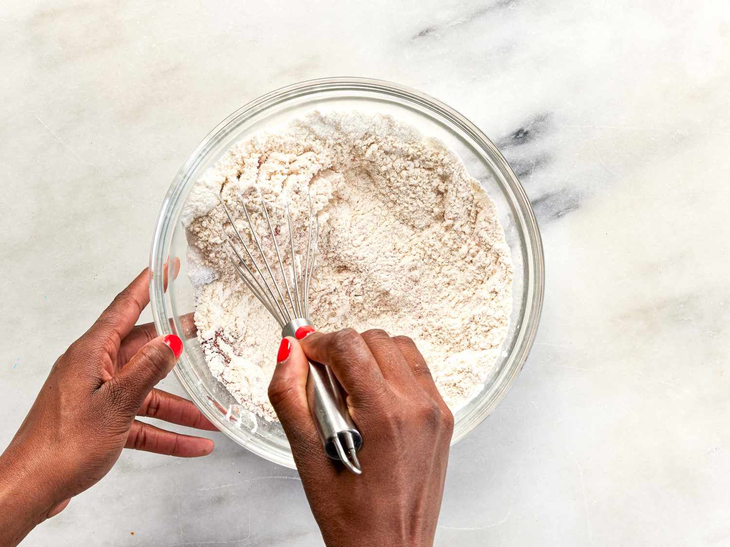 Whisking dry dredge ingredients for air-fryer fried chicken