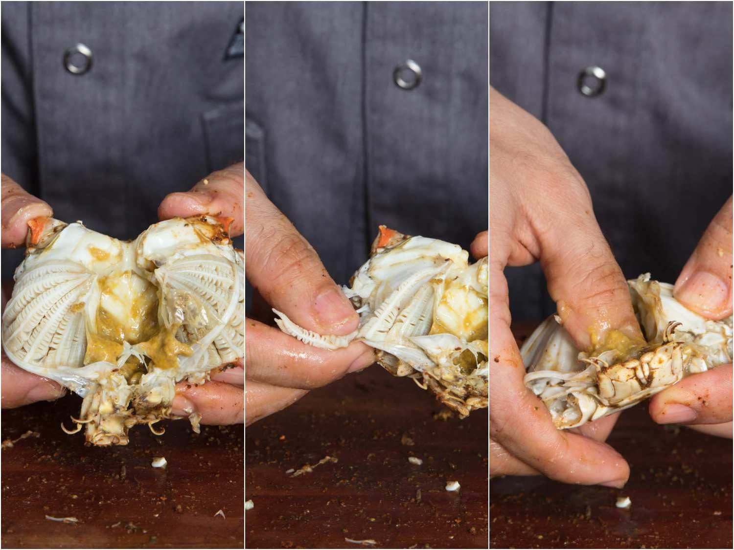 Opening up the bottom shell of a crab and removing the gills