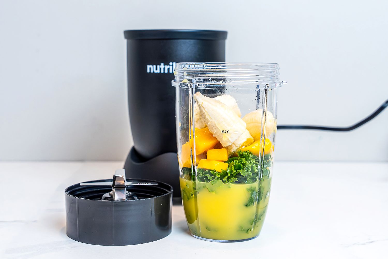 Nurtibullet Pro 900 Personal Blender filled with fruit and vegetables