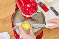 Tester zesting lemon into KitchenAid stand mixer